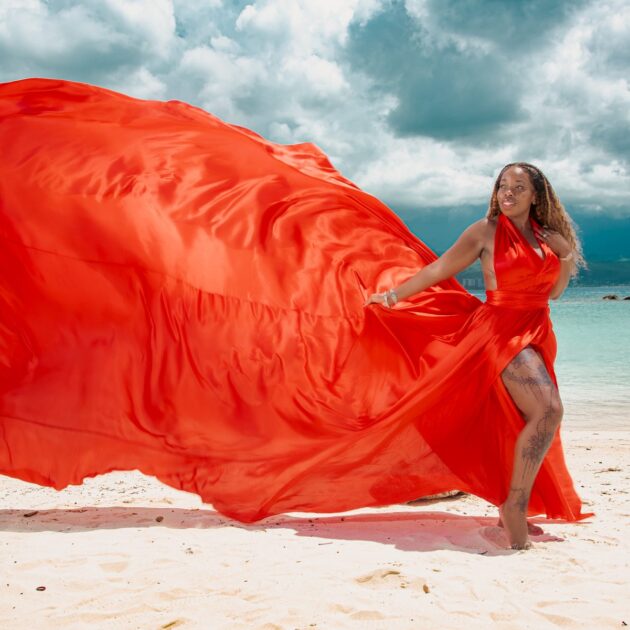 Red flying dress beach photoshoot in Jamaica